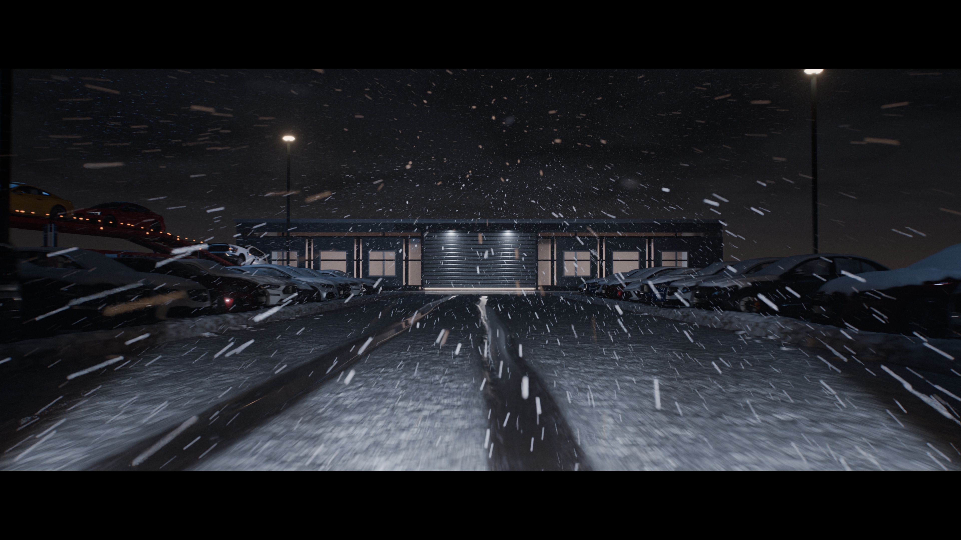 Snow blowing between parked vehicles toward a lit service bay, with two wet tracks in the foreground.